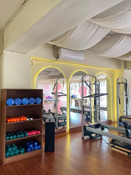 Our equipment is neatly organized and accessible. This corner features stability balls, hand weights, and other props we incorporate into sessions to add variety and challenge.