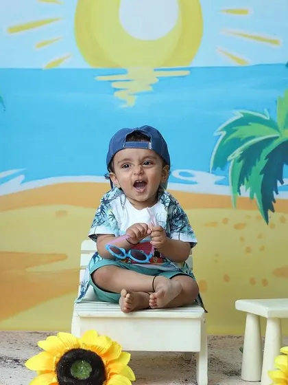 An expressive moment captured during the beach-themed session, showing the toddler's personality.
