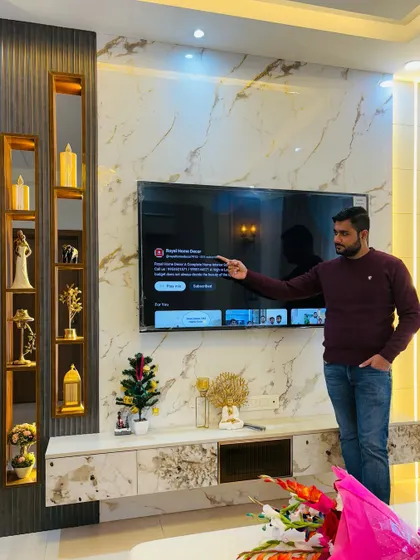 A proud moment with a completed TV unit at an ATS Nobility project. This design is the same as seen in images 9, 10, and 11, showcasing one of our popular and elegant entertainment center solutions.