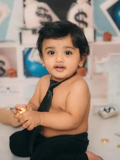 This little guy is all business, and his business is being adorable. A great portrait from his Boss Baby first birthday shoot.