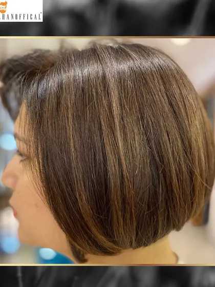Another angle of this chic bob with spun gold highlights. This style is timeless and easy to maintain with the right hair care regimen.