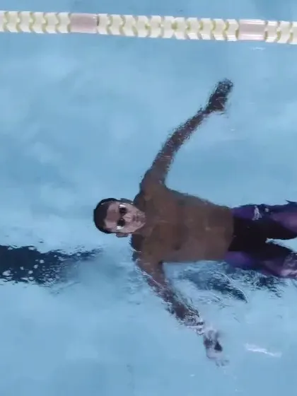 An overhead view of a swimmer demonstrating perfect form, showcasing the skills we teach.