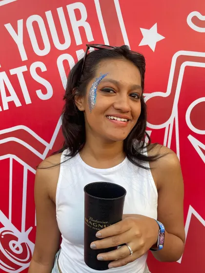 The client enjoying the festival with her custom glitter. My art is designed to last through a whole day or night of fun.