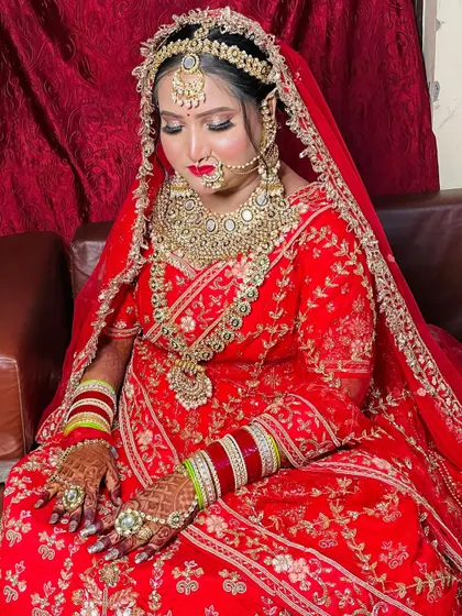 A quiet, elegant pose highlighting the bride's stunning makeup, with closed eyes to show off the detailed eyeshadow work.