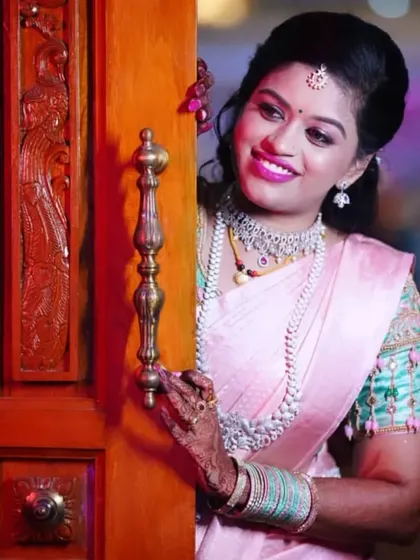 A playful and happy shot of the bride at her reception. The makeup is fresh, vibrant, and perfect for a night of celebration.