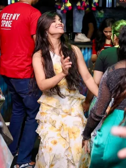 A partygoer dancing with a huge smile. This is the best reward for any DJ.
