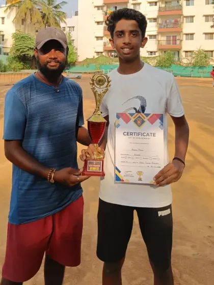 Advaith with his trophy after winning the U-14 Open Tennis Tournament. His consistent victories are a product of our focused training regimen.