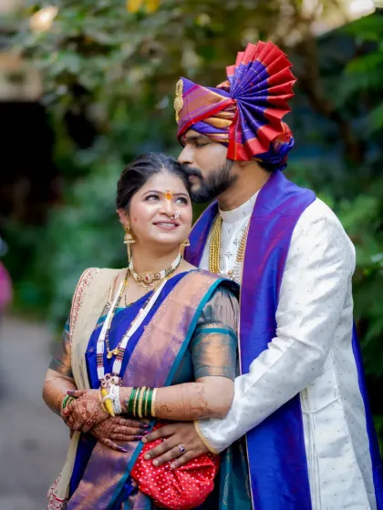 A beautiful candid shot of the couple looking at each other with love, their outfits perfectly complementing each other.