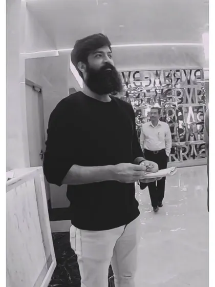 A candid shot from the PVR shoot, reviewing notes between takes. Directing choreography requires constant planning and adaptation.
