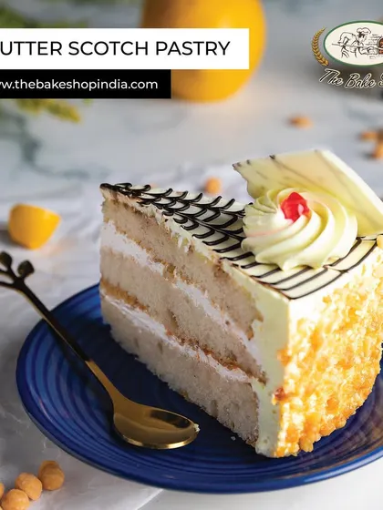 A classic Butter Scotch Pastry, with layers of light sponge, creamy frosting, and crunchy butterscotch bits.