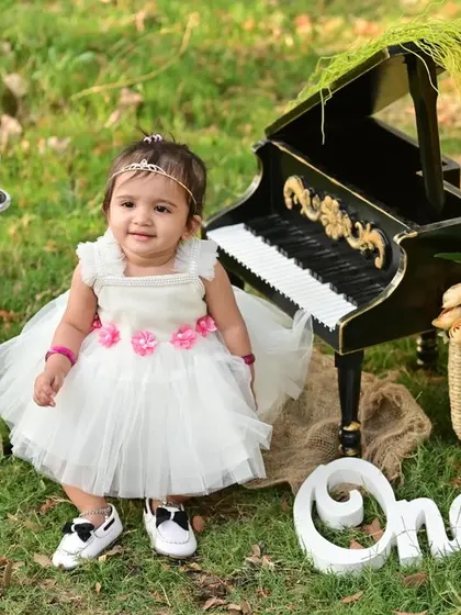 A little pianist in the park. We also offer outdoor sessions if you prefer a natural backdrop for your child's photos.