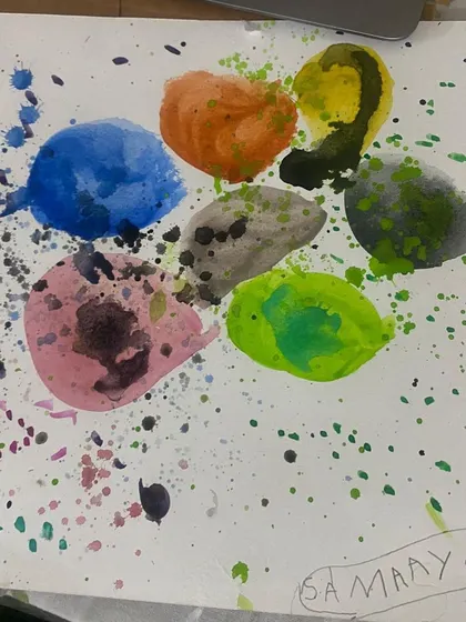 A beautiful example of a "dot" painting, with splatters and blended colors creating a dynamic effect, all from an online session.