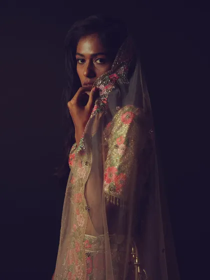 A final artistic shot from the series, with the model partially veiled by her dupatta, creating a sense of mystery and elegance.