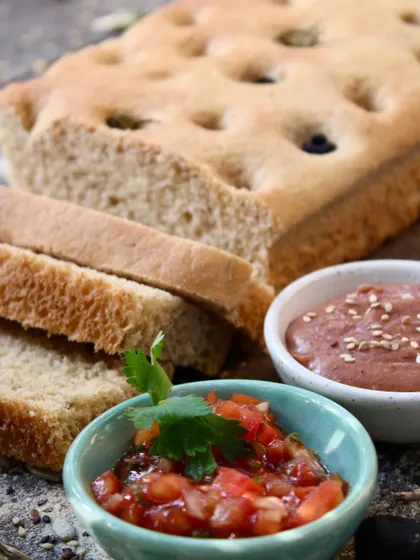 Our whole-wheat focaccia served with our homemade dips. This is how we believe bread should be enjoyed: fresh, wholesome, and with flavorful, healthy accompaniments.