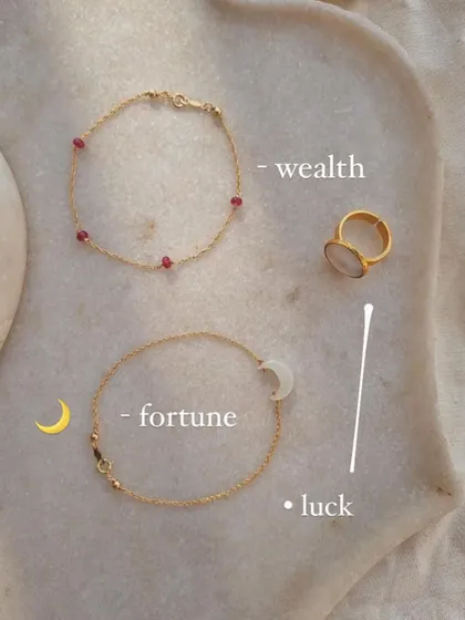 A collection of pieces for wealth and fortune, including the White Moonstone Saturn ring.