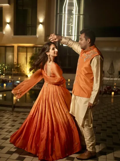 A romantic dance by the couple during their pre-wedding ceremony, set against a beautifully lit poolside.