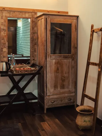 We blend rustic charm with modern convenience. Your room is equipped with essentials, set against a backdrop of natural wood and textures.