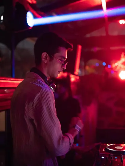 A still from the &me afters, where the mood was set with deep, hypnotic Afro House music under the red lights.