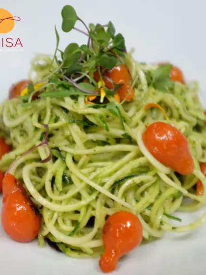 A light and healthy zucchini noodle salad. Tossed in a pesto sauce with cherry tomatoes and microgreens, this is a great gluten-free and low-carb option for corporate lunches.