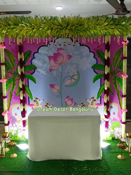 A full view of the lotus-themed Pichwai backdrop with artificial flower garlands. This design is perfect for cradle ceremonies, Annaprasana, or any small traditional function.