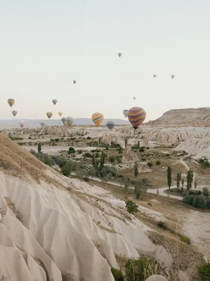 The magical landscape of Cappadocia, Turkey, with hot air balloons filling the sky. This was the breathtaking setting for Sankriti and Rahul's pre-wedding shoot.