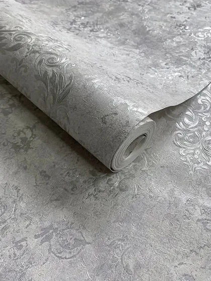 A beautiful grey wallpaper roll with a subtle, silver damask pattern for a modern take on a classic design.