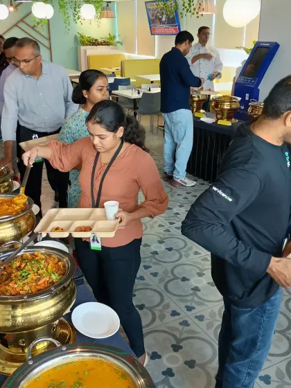 We excel at catering for corporate lunches and office events in Bangalore. This image captures employees enjoying a diverse buffet spread, featuring a variety of our North Indian curries served in elegant copper dishes, ensuring a satisfying and high-quality meal for your team.