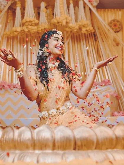 A moment of pure joy at actress Aditi Prabhudeva's Haldi ceremony. We created this custom-fabricated lotus-shaped tub for the 'arisina shastra', surrounded by a beautiful yellow and pink floral decor setup.