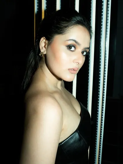 A direct look into the camera, showing how the smokey eye makeup I did for Tanvi adds intensity. The skin is kept fresh and glowing to balance the look.