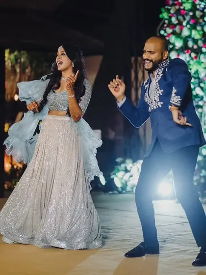 The joy of dancing the night away. We set the stage with a beautiful floral wall and professional lighting to make the Sangeet performances shine.