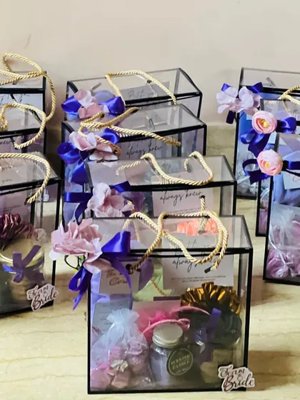 An assembly of bridesmaid hampers ready for a bridal party. I can create these in bulk, ensuring each one is perfectly identical.