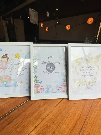 A collection of framed fairy-themed quotes and illustrations that I used to decorate the space.