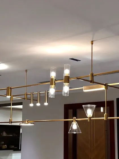 Meet the MMDLS Chandelier, a fully modular lighting system that puts you in the designer's seat. This fixture allows you to adjust, reposition, and combine different lighting elements to create a truly personalized chandelier for your space.