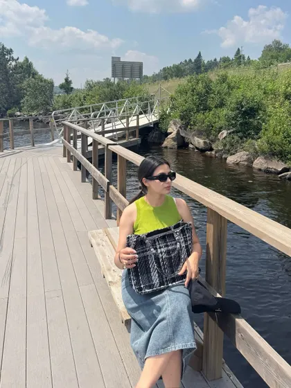 Taking a break on a wooden boardwalk in Huntsville, Ontario, a charming small town.