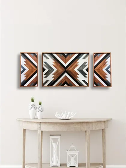 This three-piece geometric wooden wall art set uses a palette of brown, black, and white for a more neutral, rustic take on the Aztec-inspired design.