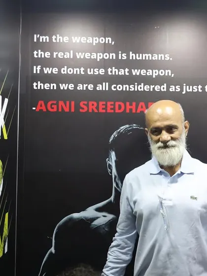 A guest stands by our motivational wall, which features quotes that inspire our athletes every day.