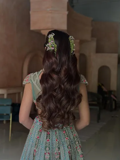 Another shot of the stunning wavy half-updo, showcasing the rich color and healthy shine of the hair. This style is both elegant and effortlessly beautiful.
