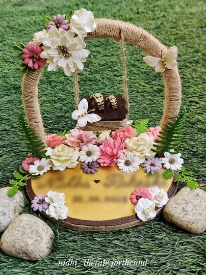 I designed and handmade this floral ring platter for an engagement ceremony. The rustic jute-wrapped hoop and abundance of flowers create a beautiful garden theme.