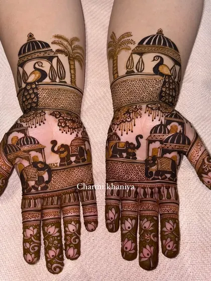 A beautiful Teej mehendi design with peacocks and elephants.