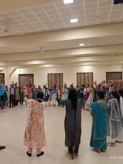 Teachers standing in a circle, participating in a group activity during a workshop. I use these collaborative exercises to build a sense of community and demonstrate the power of connection in a classroom setting.