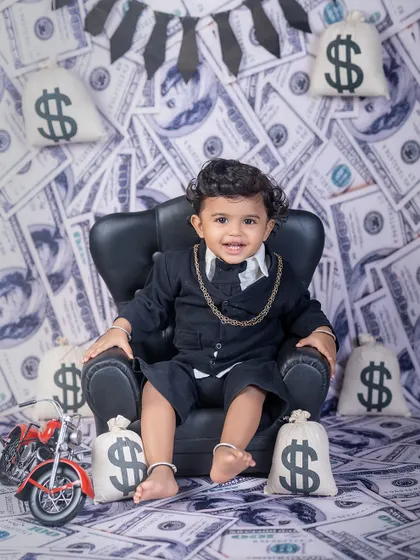 Meet the little boss man! My "Boss Baby" theme is always a hit, perfect for capturing that big personality in a tiny package. With a custom money-themed backdrop and props, we create memories that are both fun and unforgettable.