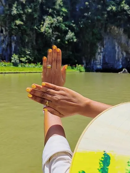 Taking our nails on vacation. This client is rocking a bright, sunny yellow manicure that looks stunning against the beautiful backdrop of Vietnam.