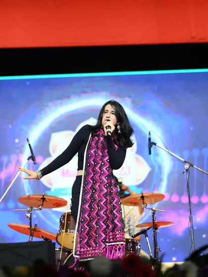 Singing my heart out at the Ganesh Kala Krida Rangmanch. A big stage and a big crowd bring out the best in us.