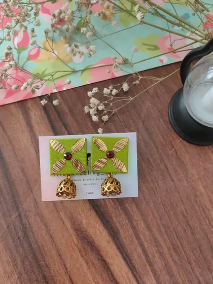 My gotapatti earrings are a festive favorite. These square fabric studs feature golden gotapatti work and a small jhumki drop, available in brown, green, and grey.