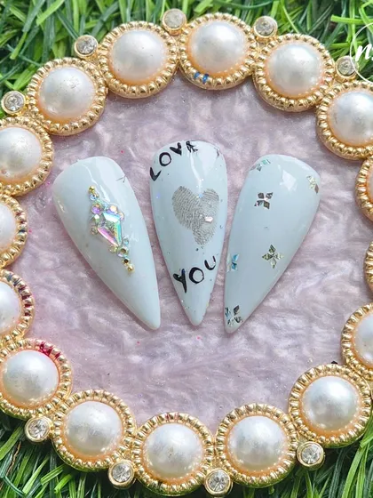 Simple, elegant, and full of love. This student work features clean lines, a silver heart, and perfectly placed crystals.