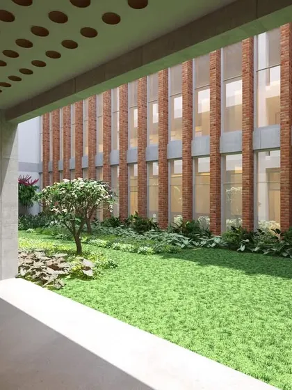 The internal courtyard at JSW Nagaur is a key biophilic feature, bringing high-quality natural light and ventilation into deeper office spaces. This green oasis also serves as a social hub for employees.
