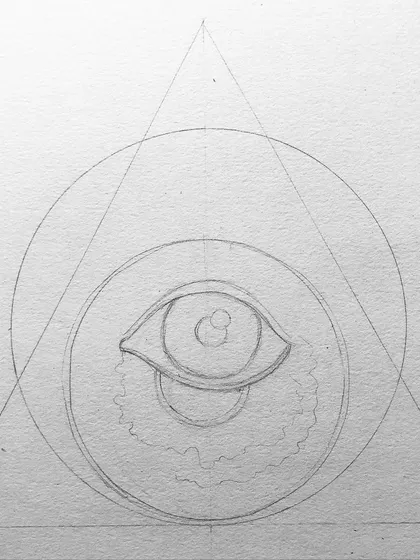 The initial geometric sketch for the vampire eye tattoo design.