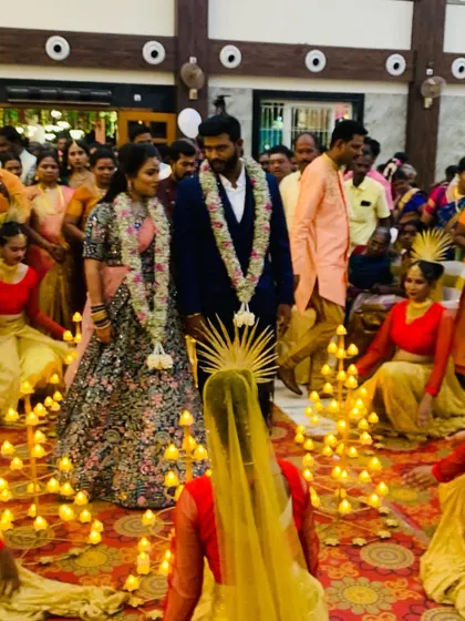 The couple stands surrounded by our dancers in this Diya entry at Ramani Shankar Mahal in Vellore. This traditional welcome is perfect for any auspicious occasion.