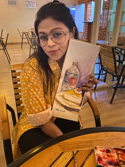 Me with my watercolor sketch of the mango cheesecake from Glen's. A perfect start to the day with good food and a little bit of painting.