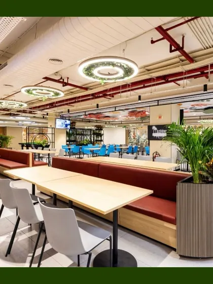 In this dining area, we used large, stylish planters to house tall palms and other foliage. These act as natural dividers between seating sections and add a touch of sophistication to the space.